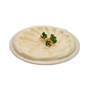 Creamy garlic dip in a bowl.
